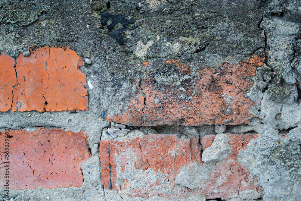 red brick wall. cracked bricks. bricks texture. curved dirty red brick wall. cracked bricks. bricks texture. curved dirty