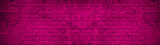 Abstract magenta pink dark colorful painted grunge damaged rustic brick wall texture banner panorama 