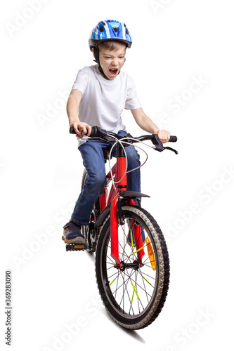 Happy boy riding a bicycle