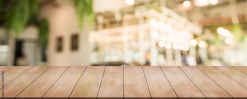 Empty wooden top table with on blur panoramic restaurant background, banner background, panoramic background