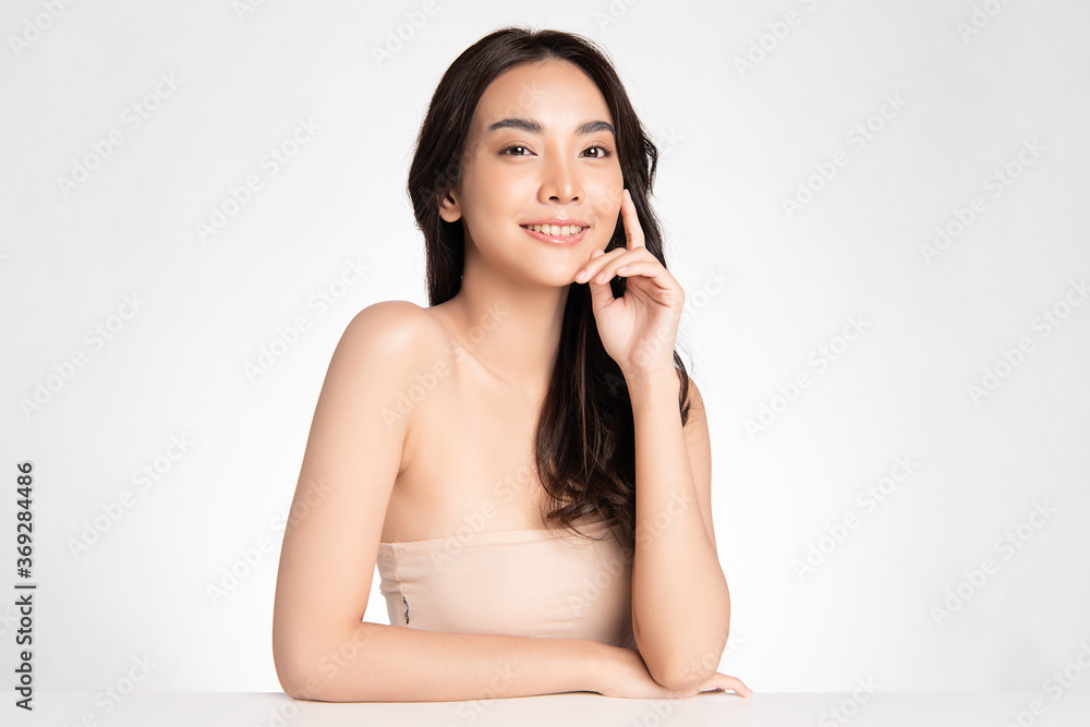 Beautiful Young asian Woman with Clean Fresh Skin on white background, Face care, Facial treatment, Cosmetology, beauty and spa, Asian women portrait Beautiful Young asian Woman with Clean Fresh Skin on white background, Face care, Facial treatment, Cosmetology, beauty and spa, Asian women portrait
