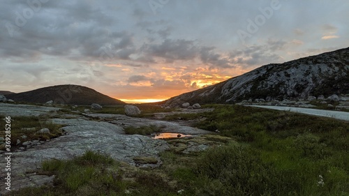 Sunset withwater reflection in the norwegian mountains