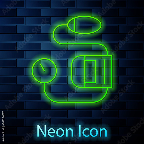 Glowing neon line Blood pressure icon isolated on brick wall background. Vector Illustration.