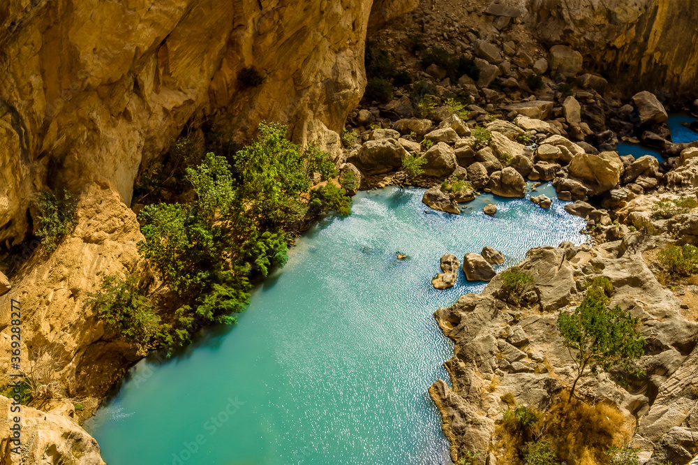 A view looking down on the Gaitanejo river as it flows through the gorge from the Caminito del Rey pathway near Ardales, Spain in the summertime A view looking down on the Gaitanejo river as it flows through the gorge from the Caminito del Rey pathway near Ardales, Spain in the summertime
