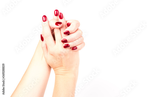 Stylish trendy female manicure. red manicure nails on white background
