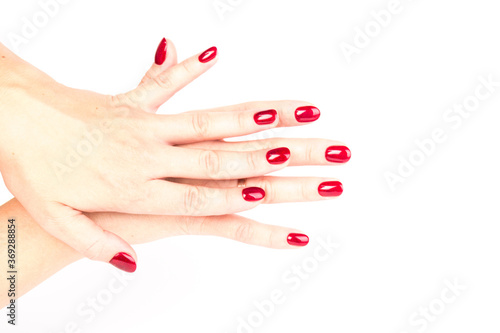 Stylish trendy female manicure. red manicure nails on white background