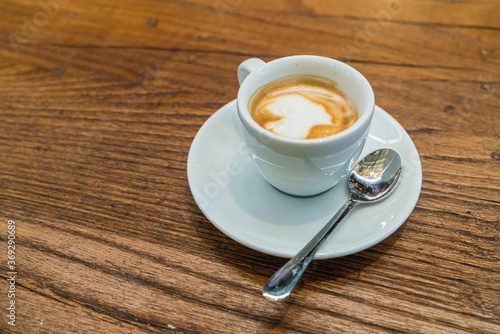 Traditional Italian espresso coffee on wooden table