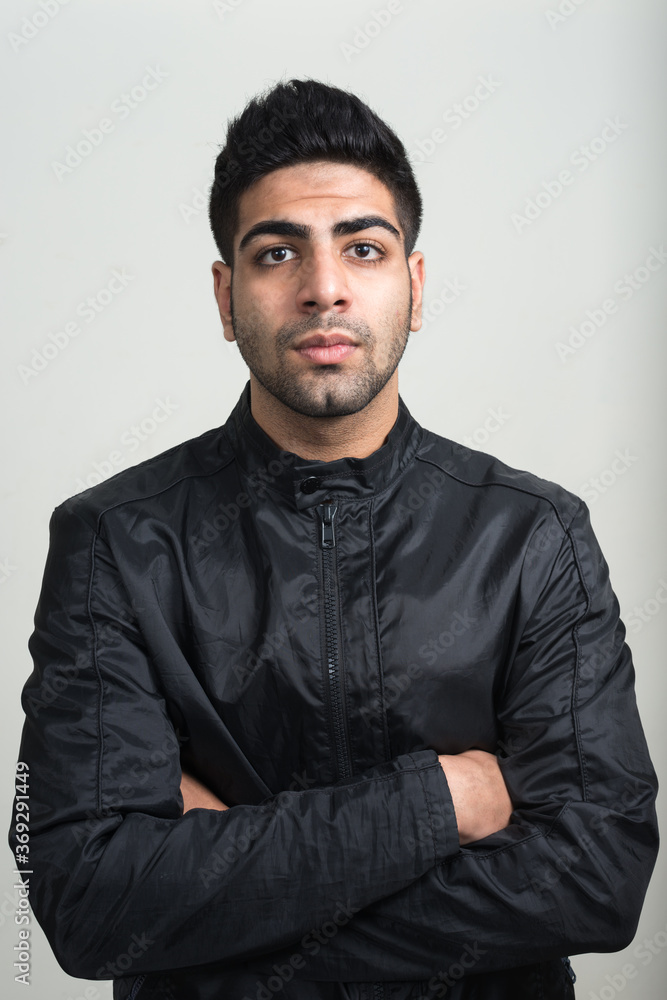 Obraz premium Portrait of young handsome bearded Indian man