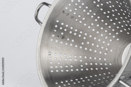 New metal kitchen colander isolated on white