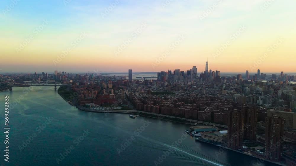 Beautiful sunset from Williamsburg Bridge to Downtown and Midtown Manhattan, aerial Panoramic shoot of New York 2020 post pandemic, with the cleanest and free of pollution sky ever seen in this city. Beautiful sunset from Williamsburg Bridge to Downtown and Midtown Manhattan, aerial Panoramic shoot of New York 2020 post pandemic, with the cleanest and free of pollution sky ever seen in this city.
