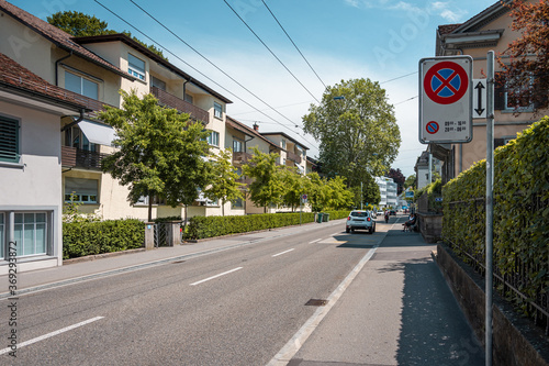 Neat  tidy street with bushes and hedges. European city design