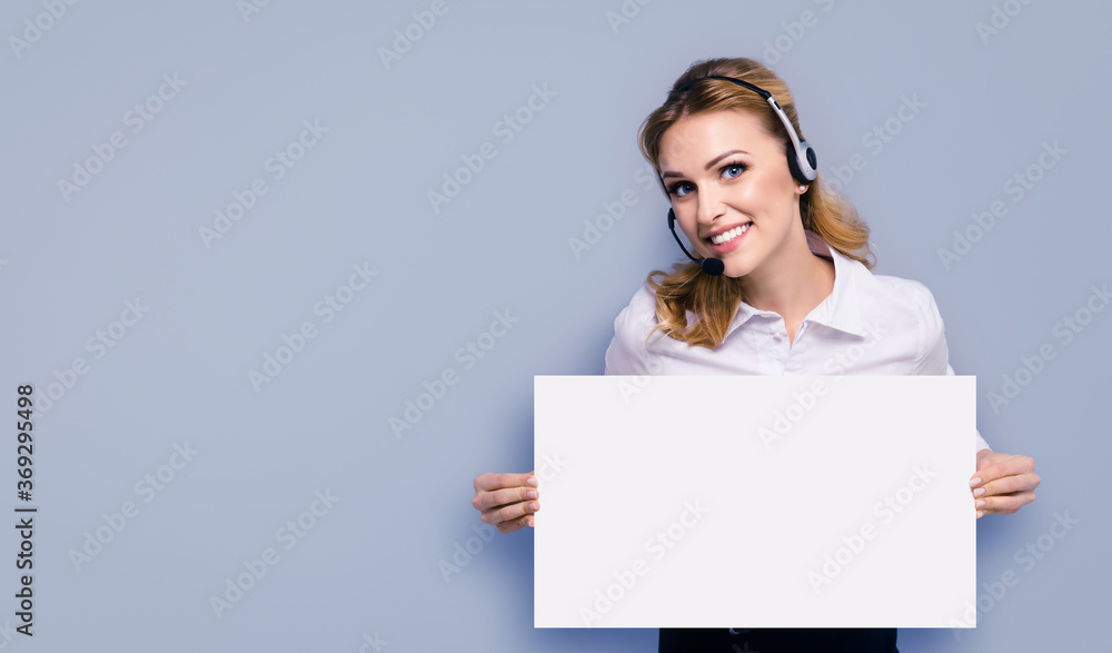Call Center Service. Customer support or sales agent. Businesswoman or caller phone operator holding empty paper sign board banner with copy space. Helping, answering, consulting. Isolated over grey. Call Center Service. Customer support or sales agent. Businesswoman or caller phone operator holding empty paper sign board banner with copy space. Helping, answering, consulting. Isolated over grey.