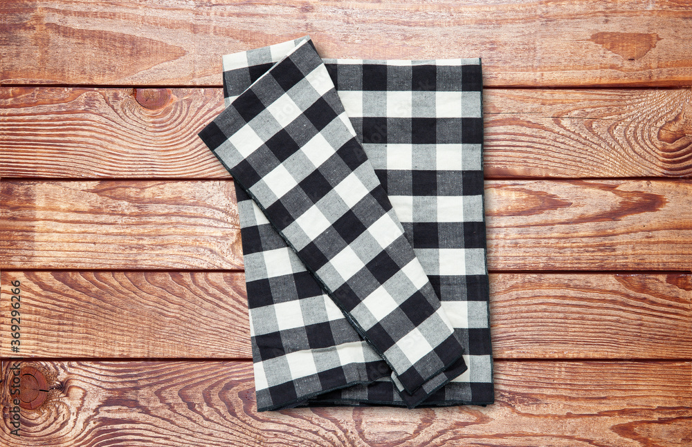 Obraz premium Napkin. Stack of dish towels on wooden desk. Top view