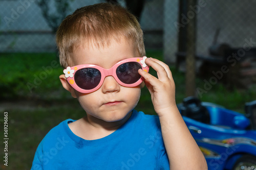 a boy with funny sunglasses