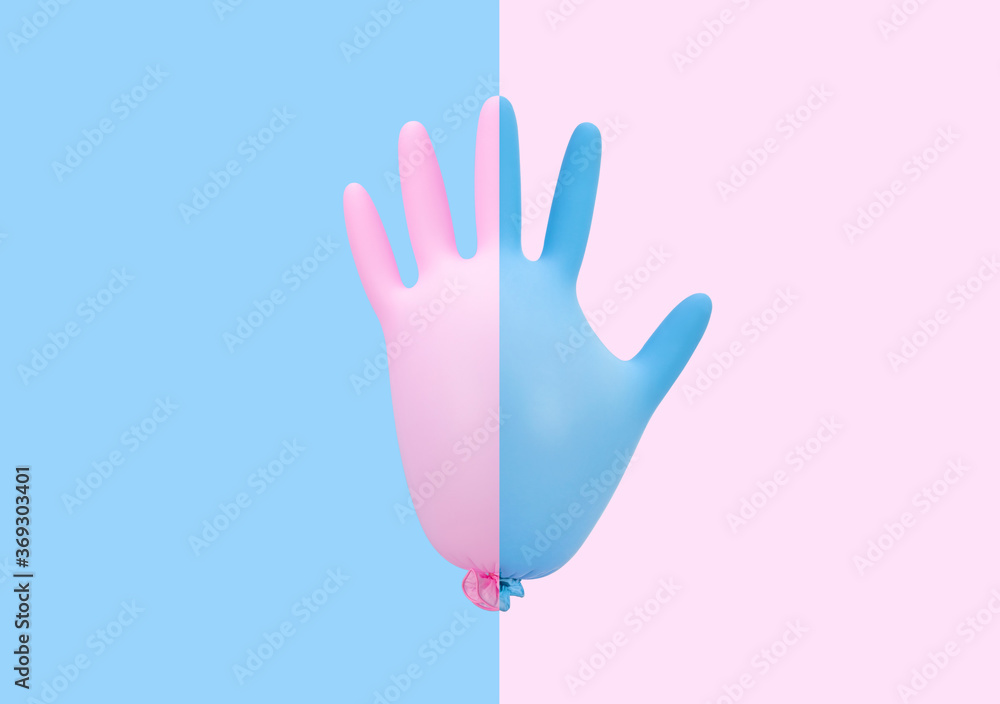 Obraz premium Colorful medical inflated glove on pink blue background. Prevention of coronavirus, covid-19. Minimal healthcare concept.