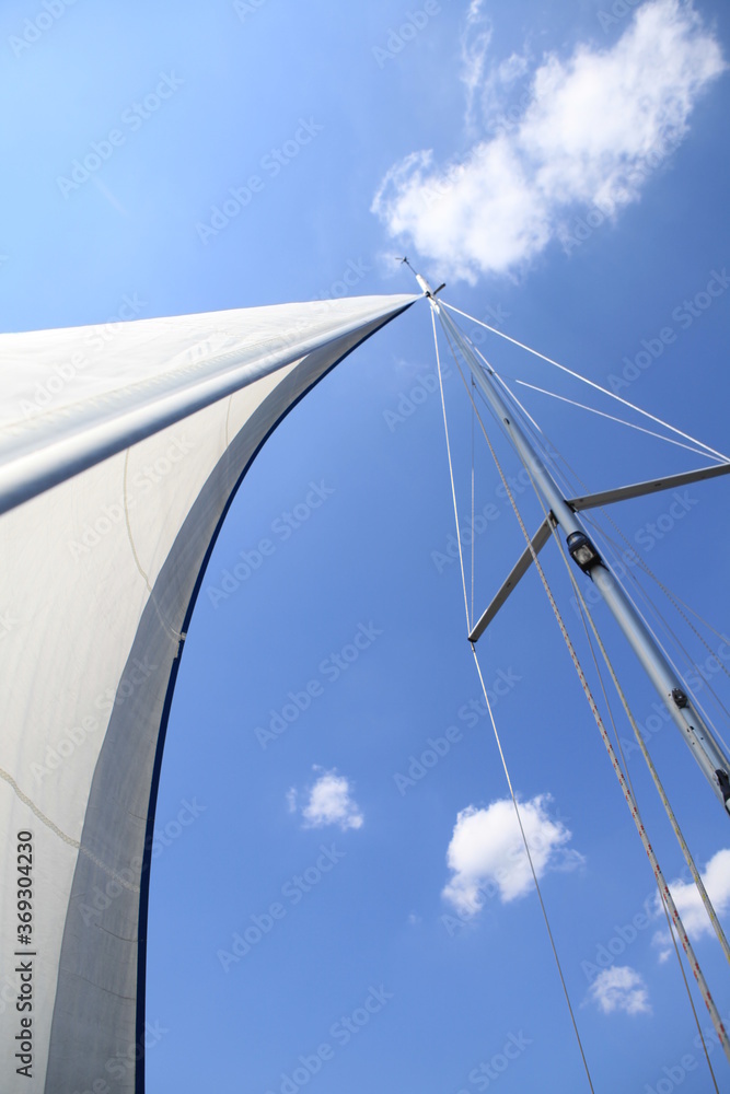 Sails on a yacht against the sky
