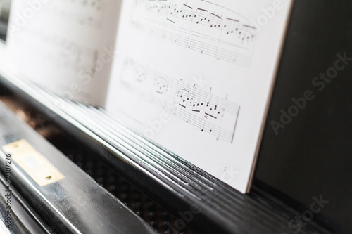 Wallpaper Mural Musical instrument grand piano with music book on the shelf pianist teacher music pedagogue learn sophisticated practice play composition music school teacher teaching technical college music college Torontodigital.ca