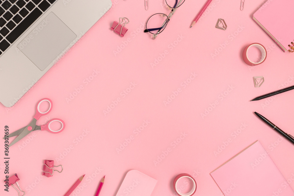 Frame made of laptop, glasses and stationery on a pink pastel background. Workspace concept with copy space. Frame made of laptop, glasses and stationery on a pink pastel background. Workspace concept with copy space.