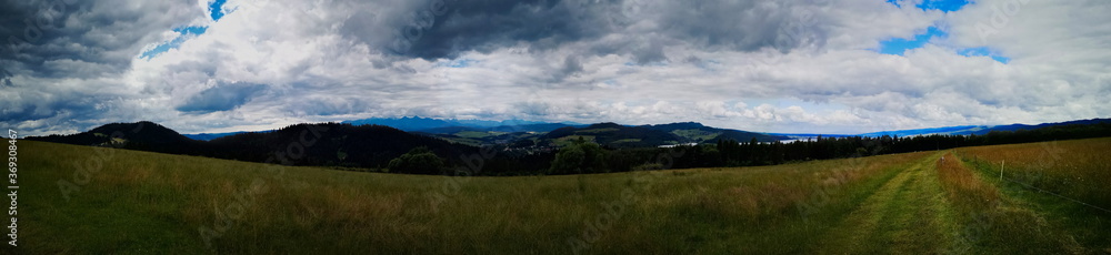 Fototapeta premium Panorama view of Tatras from Majerz pasture. Pieniny National Park. Czorsztyn. Poland