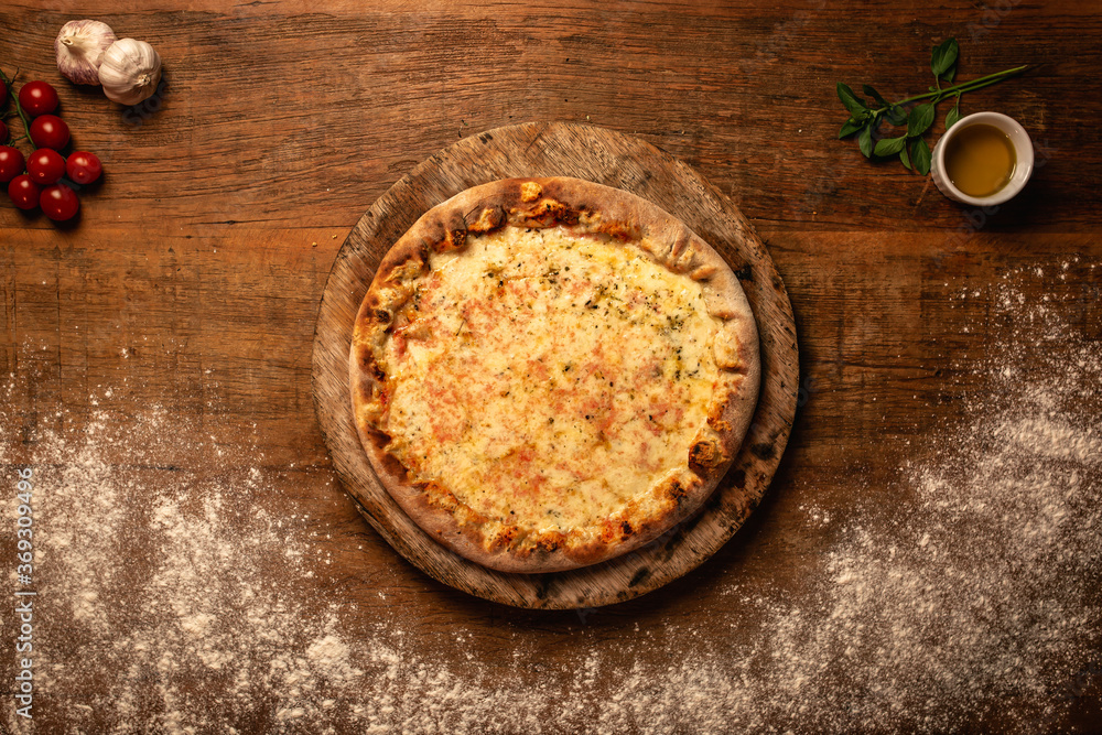Top down pizza on wooden table for restaurant menu Top down pizza on wooden table for restaurant menu