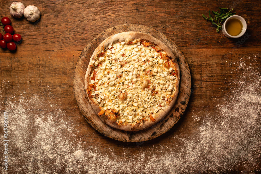 Top down pizza on wooden table for restaurant menu Top down pizza on wooden table for restaurant menu