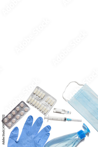 Gloves, syringe, mask, tablets and sanitizer on a white background. Means for the prevention and treatment of coronavirus. Covid-19, healthcare concept.