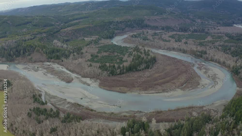 Cinematic aerial shot of river bend in dense rain forest in Pacific Northwest Cinematic aerial shot of river bend in dense rain forest in Pacific Northwest