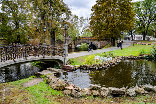 The city canal park in Riga, Latvia and bridge with locks