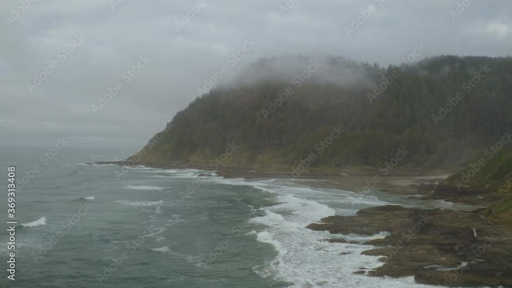 Cinematic aerial shot of rugged coastline in Oregon Coast Cinematic aerial shot of rugged coastline in Oregon Coast