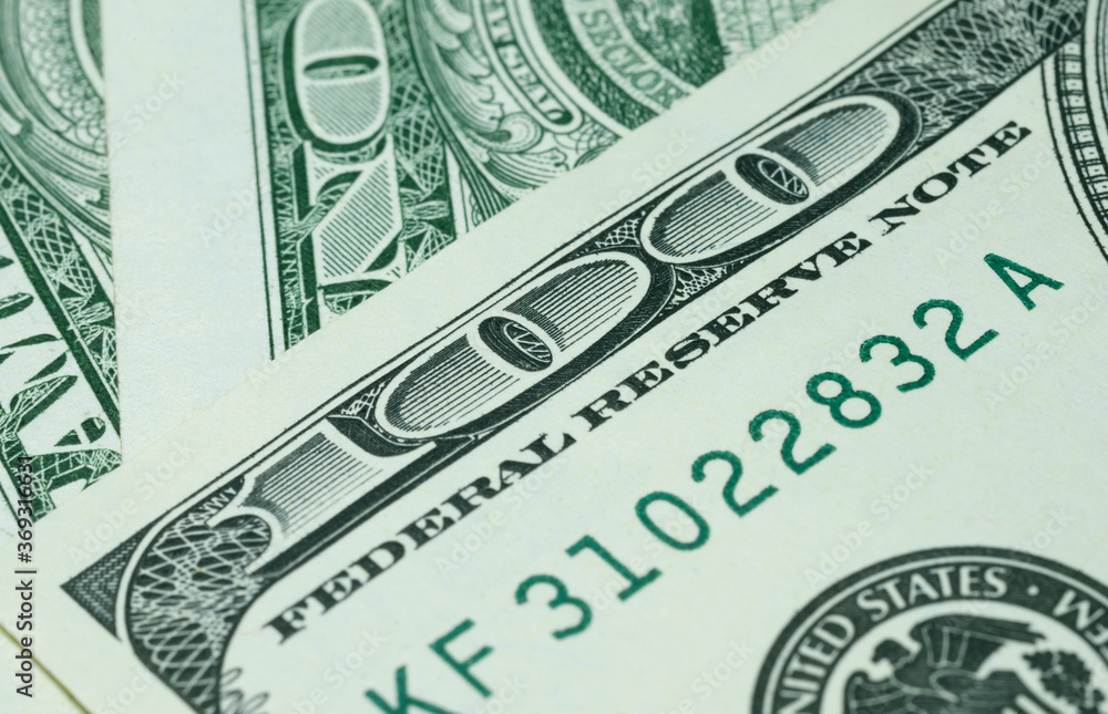 Part of the one hundred USA dollar banknote with number 100 close up, writing Federal Reserve Note Part of the one hundred USA dollar banknote with number 100 close up, writing Federal Reserve Note