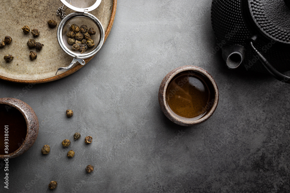 Green japanese tea on black stone table. Top view with copy space Green japanese tea on black stone table. Top view with copy space