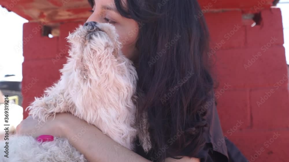 a girl hugs her fluffy dog a girl hugs her fluffy dog