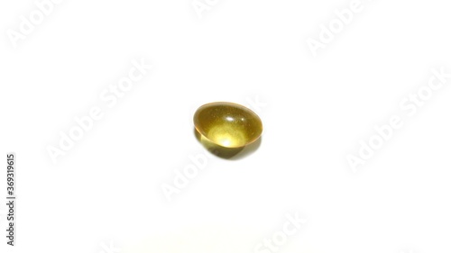 Cod liver oil or fish oil gel capsules on white background. It contains omega 3 fatty acids , EPA, DHA