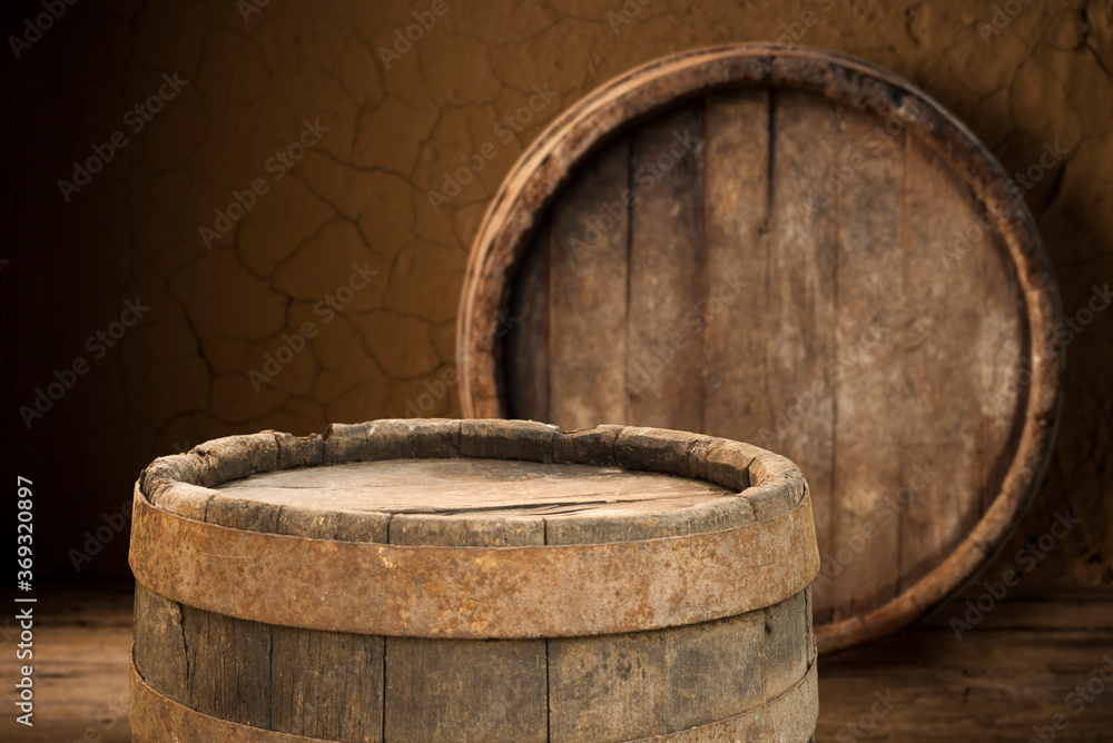 Beer barrel with beer glasses on a wooden table. The dark brown background. Beer barrel with beer glasses on a wooden table. The dark brown background.