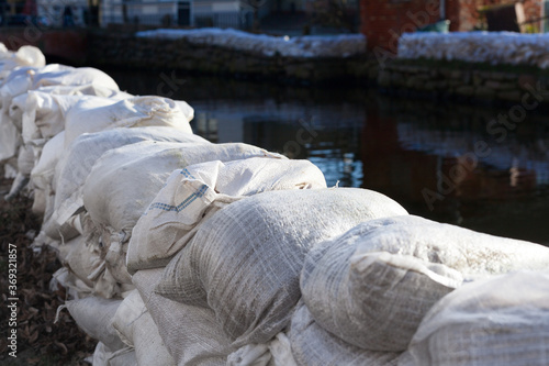 Wallpaper Mural Temporary dam made of white sandbags prevention river flooding extreme weather danger safety emergency fire brigade environmental disaster Torontodigital.ca