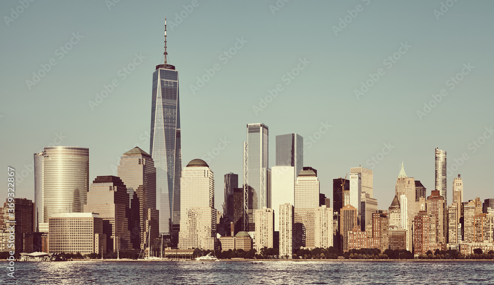 Manhattan skyline with cloudless sky at sunset, color toning applied, New York City, USA. Manhattan skyline with cloudless sky at sunset, color toning applied, New York City, USA.