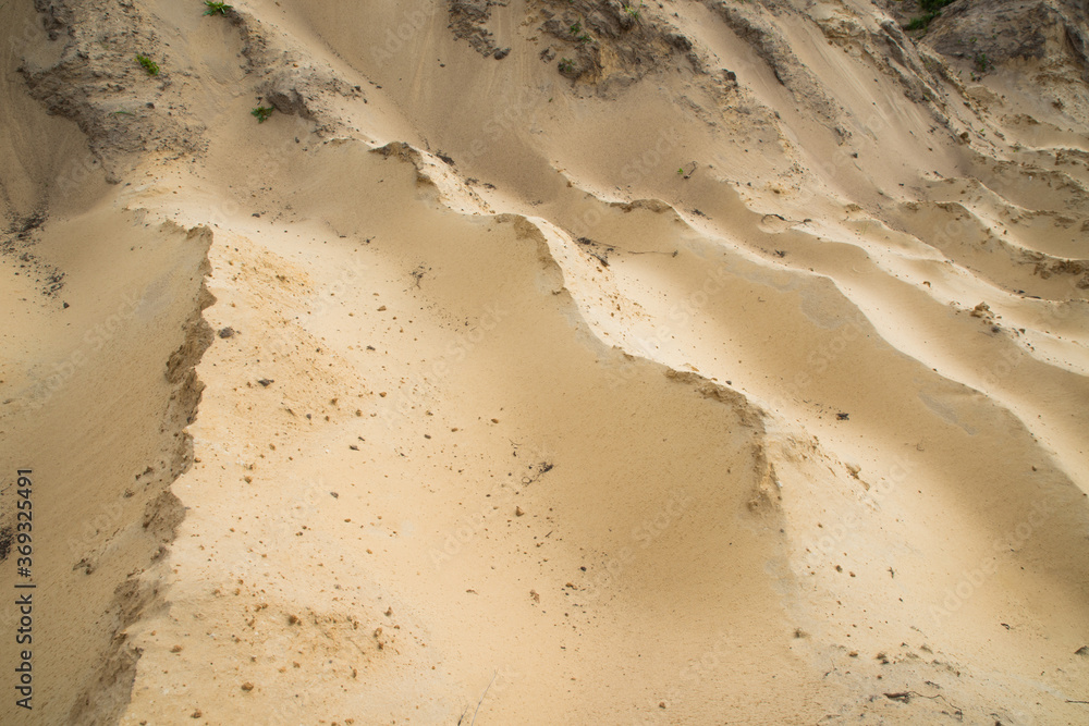 Sand quarry. Texture. Traces of production.