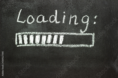 The loading process is shown in white on a chalkboard. Stop motion animation.