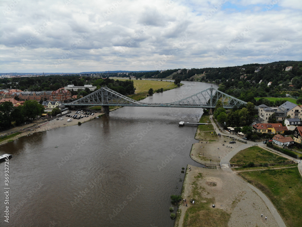 Aerial view of Loschwitz Bridge (blue wonder), a cantilever truss bridge over the river Elbe which connects the city districts Loschwitz and Blasewitz in Dresden, Saxony, Germany. Aerial view of Loschwitz Bridge (blue wonder), a cantilever truss bridge over the river Elbe which connects the city districts Loschwitz and Blasewitz in Dresden, Saxony, Germany.