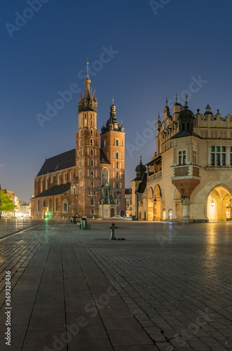 Main market square  Cloth Hall and St Mary s church in the night  Krakow  Poland