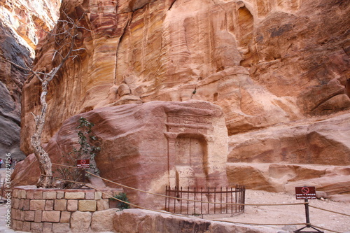 Passage through Sik canyon to the temple-mausoleum of Al-Khazneh in the ancient city of Petra in Jordan
