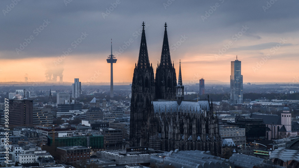 Cologne Cathedral and Colonius TV Tower at sunset, Germany Cologne Cathedral and Colonius TV Tower at sunset, Germany