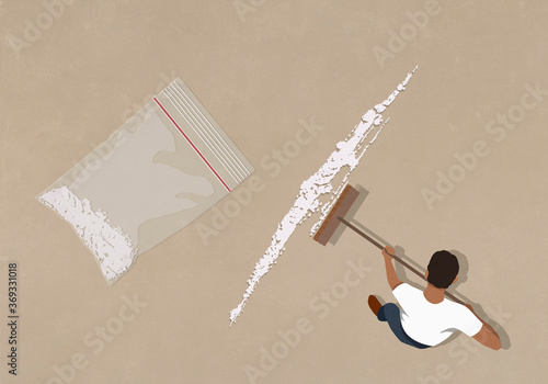 Man sweeping up cocaine with broom