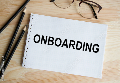 Word writing text Onboarding. Business concept for Action Process of integrating a new employee into an organization Man holding marker notebook page crumpled papers several tries mistakes.