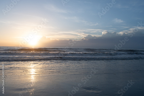 Morning sunrise on the beach © chris