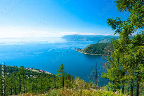 Looking over the Angara River and Lake Baikal from the Chersky Peak in the Listvyanka village.  photo
