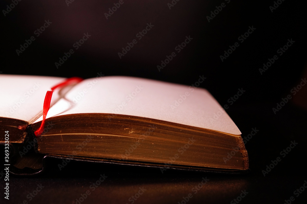 Open book on the table.