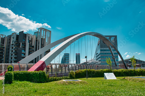Modern cycle and pedestrian footbridge that connects Gino Valle square with the Portello park in Milan
