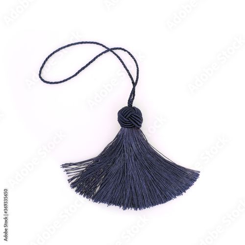 Blue silk tassel isolated on white background for creating graphic concepts