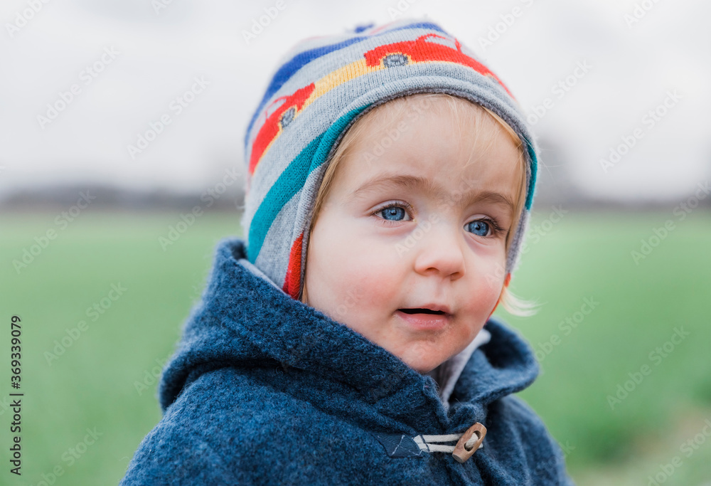 Portrait of toddler girl with warm clothing Portrait of toddler girl with warm clothing